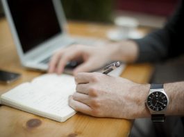 busy office worker taking notes