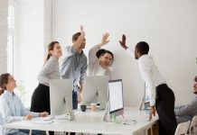 team celebrating in office