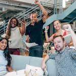 group of pumped up and motivated people in office