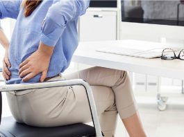 woman sitting with aching back