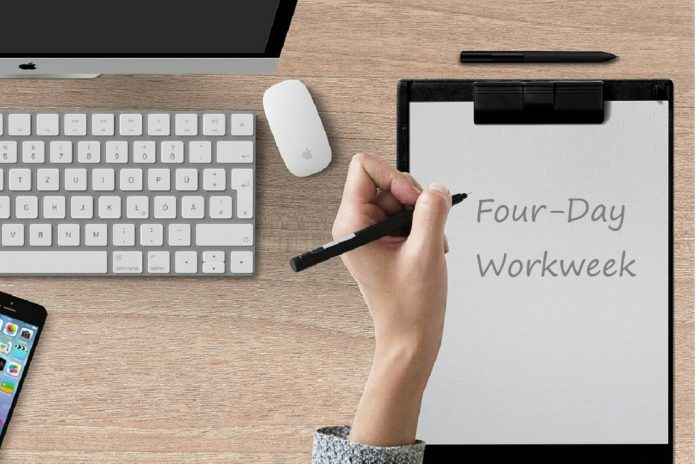 notepad with Four-Day Workweek written on page