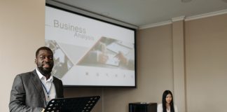 Man presenting slide of business analysis