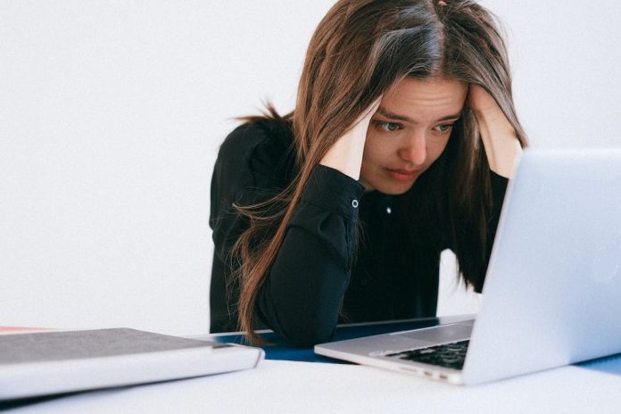 stressed employee at laptop