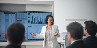 Woman Presenting at a screen in the Office