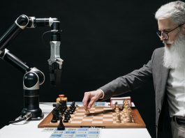 Man playing chess with computer