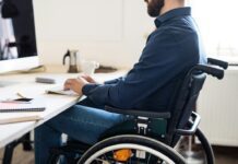 Disabled worker at work station