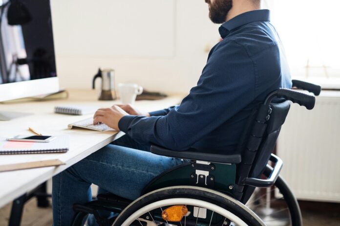 Disabled worker at work station