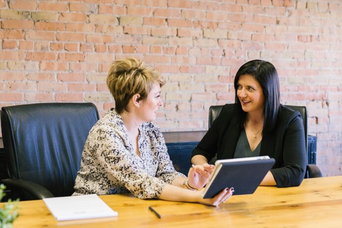 employees discussing Pay transparency