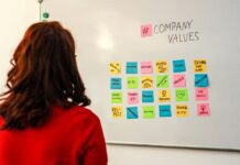 employee looking at white board with company values