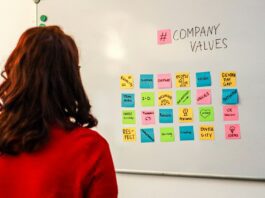 employee looking at white board with company values