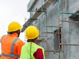 Construction workers viewing site