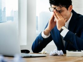 HR manager stressed sitting desk