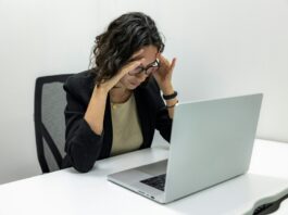 Stressed HR professional sitting at desk