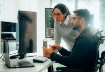 Everyone’s Talking About AI. Few Are Actually Ready for It Employees having AI Conversation