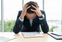 The Proactive Role of HR in Addressing High-Performer Burnout HR professional in state of burnout