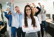 How To Boost Employee Engagement And Productivity Group of happy employees